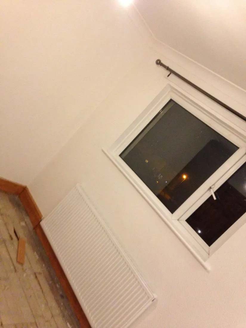 Freshly painted interior walls and window surround by CH Supreme Decor